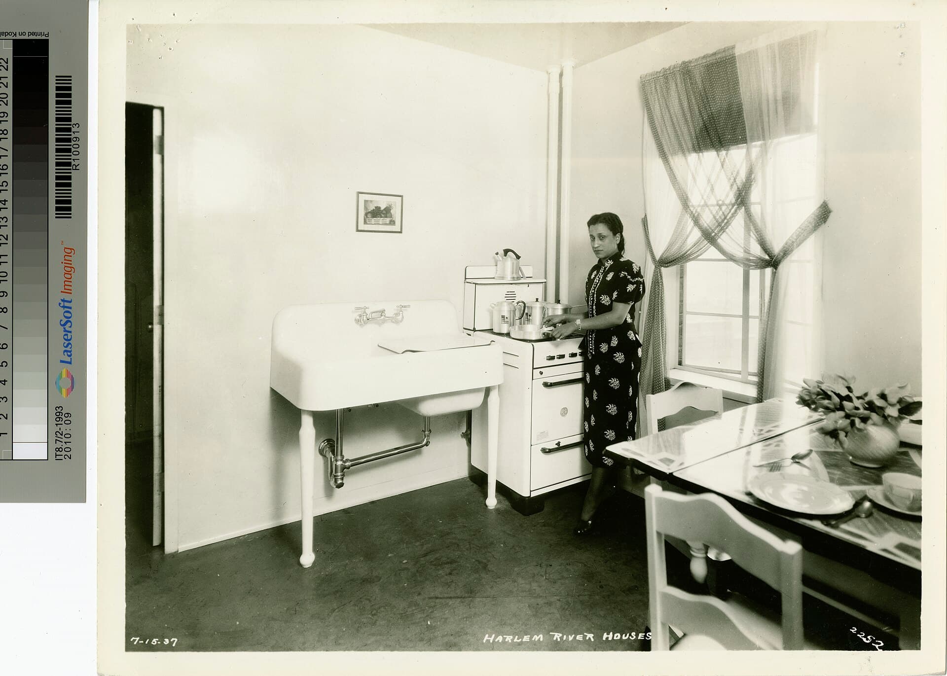 A tenant at the stove in a new Harlem River Houses kitchen, 1937