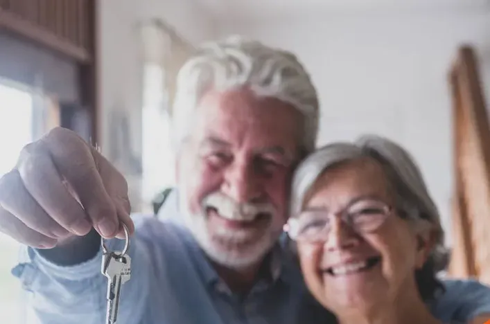A smiling older couple at home