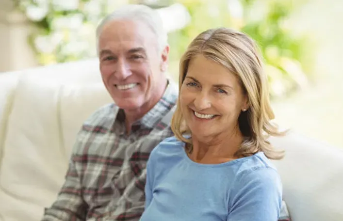 Smiling older couple at home