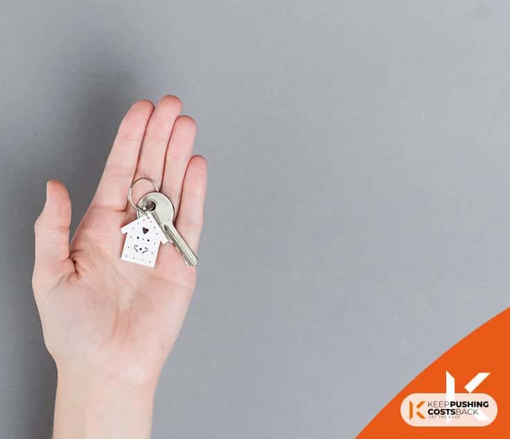 Real estate agent with house model and keys