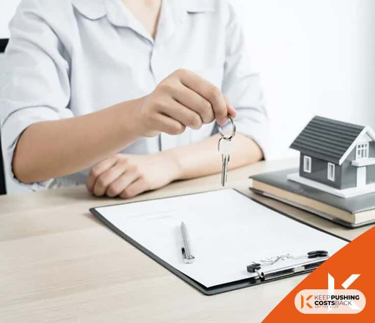 Real estate agent with house model and keys