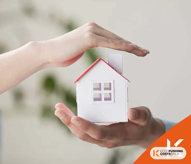 Real estate agent with house model and keys