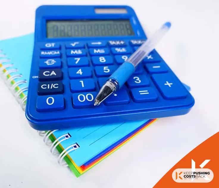 Calculator and pen to calculate your tax returns